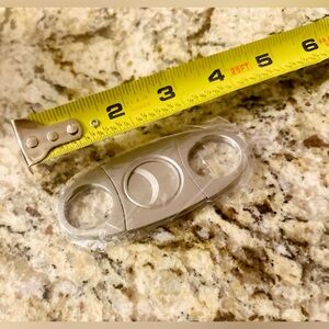 Stainless steel cigar cutter. New, unopened